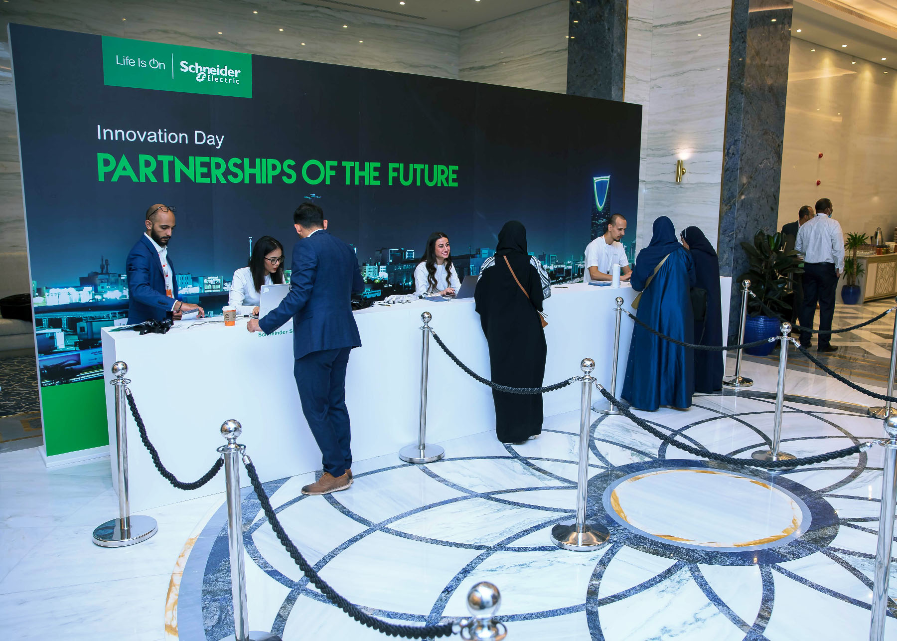 Schneider Electric event reception desk  with attendees