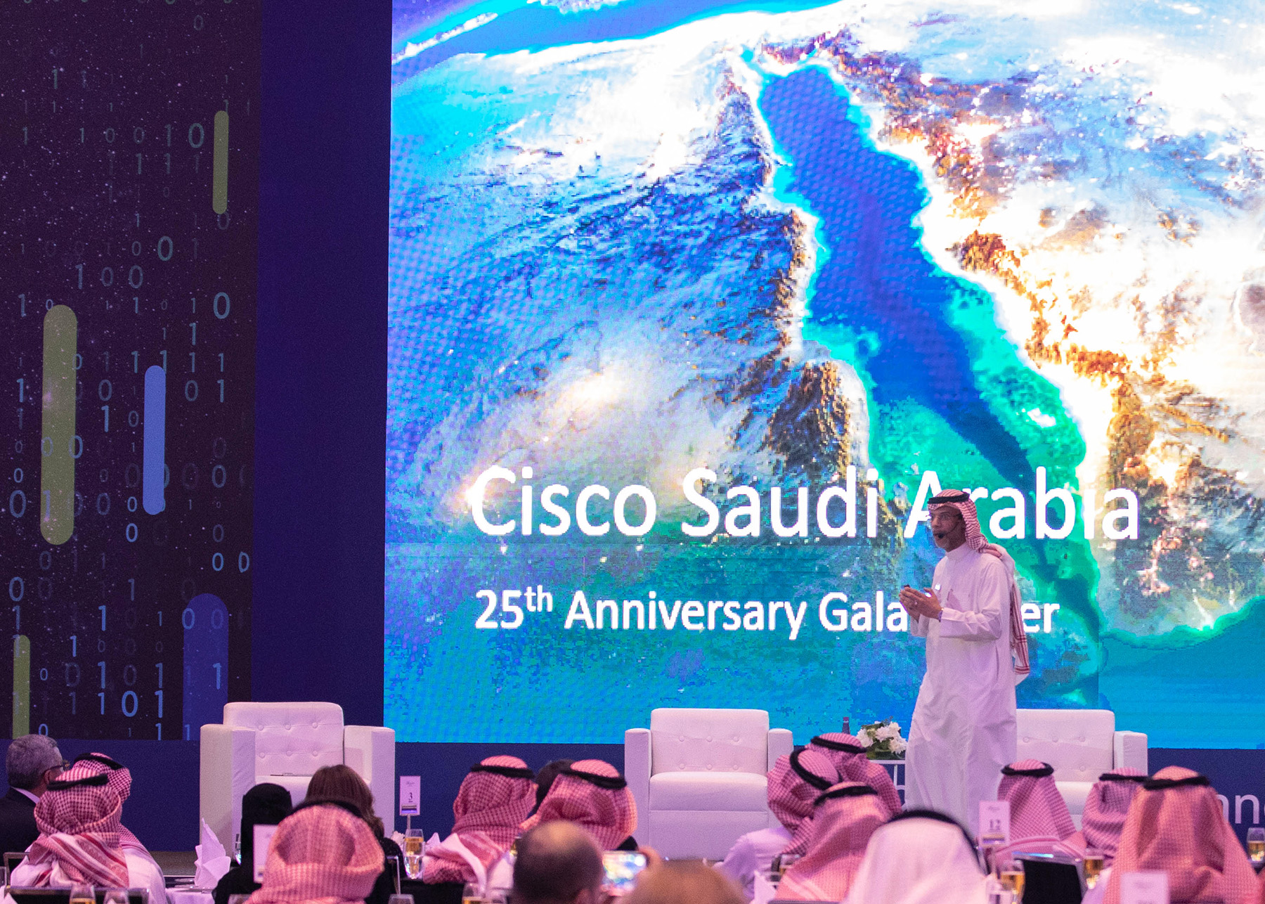 Photo from the Cisco event with a speaker engaging the audience