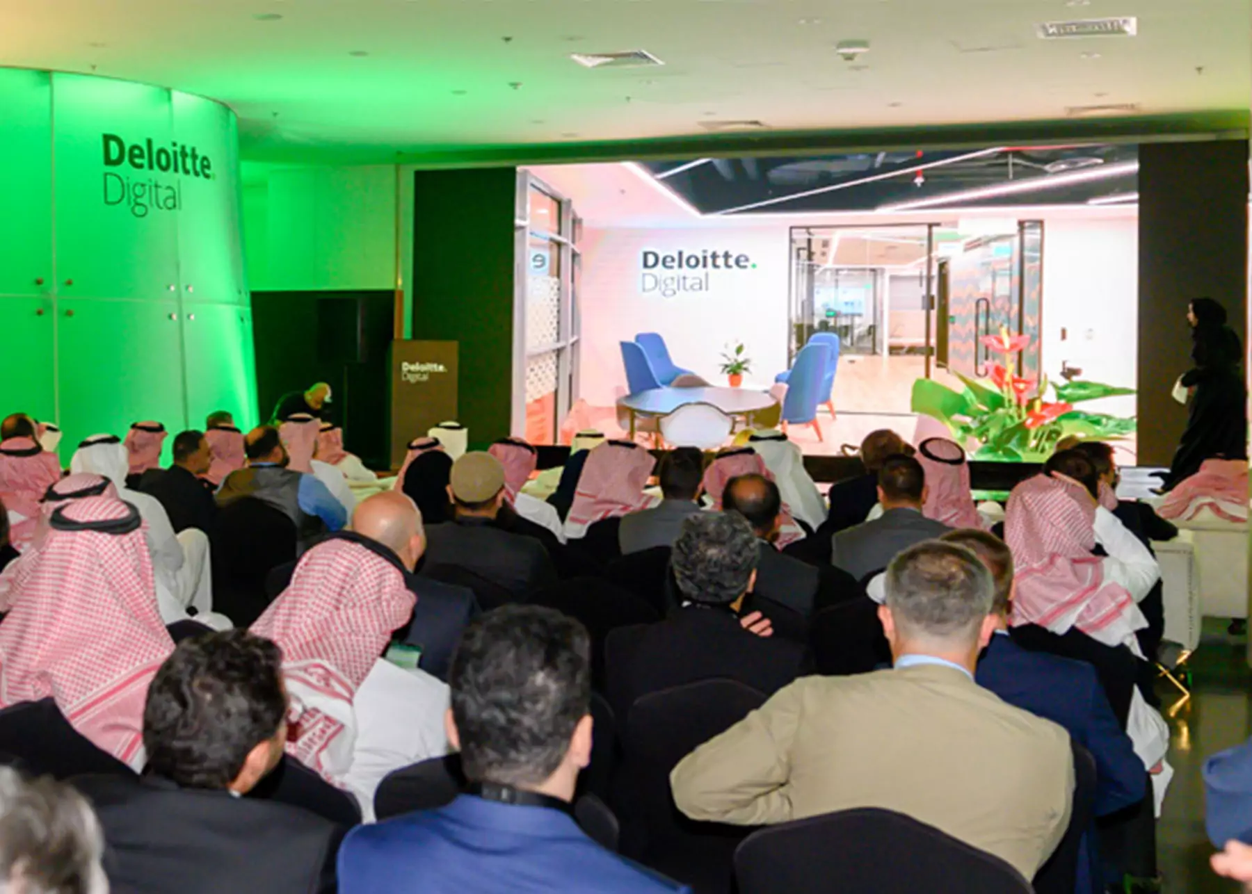 Engaged audience at a Deloitte event