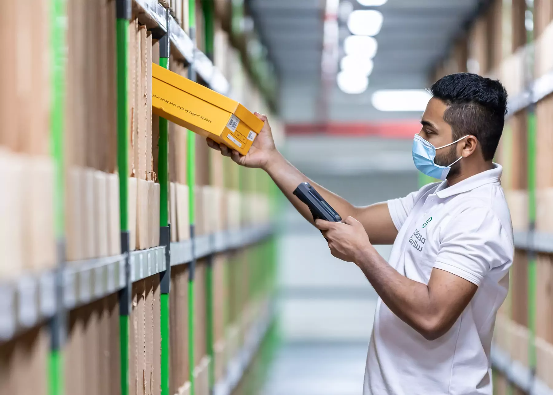 Employee scanning a parcel at the warehouse