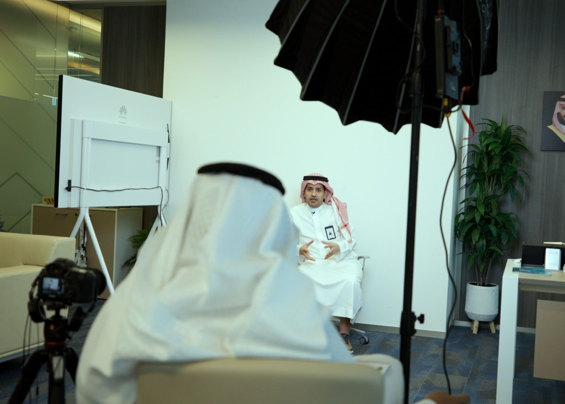 Behind-the-scenes photo of an interview with a Saudi man