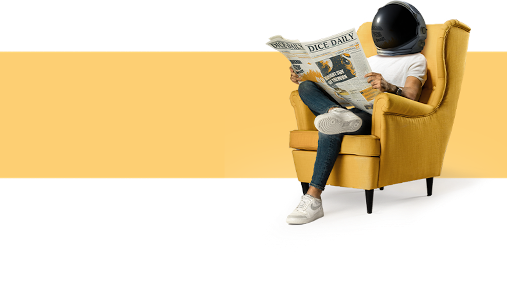 Man sitting reading a newspaper