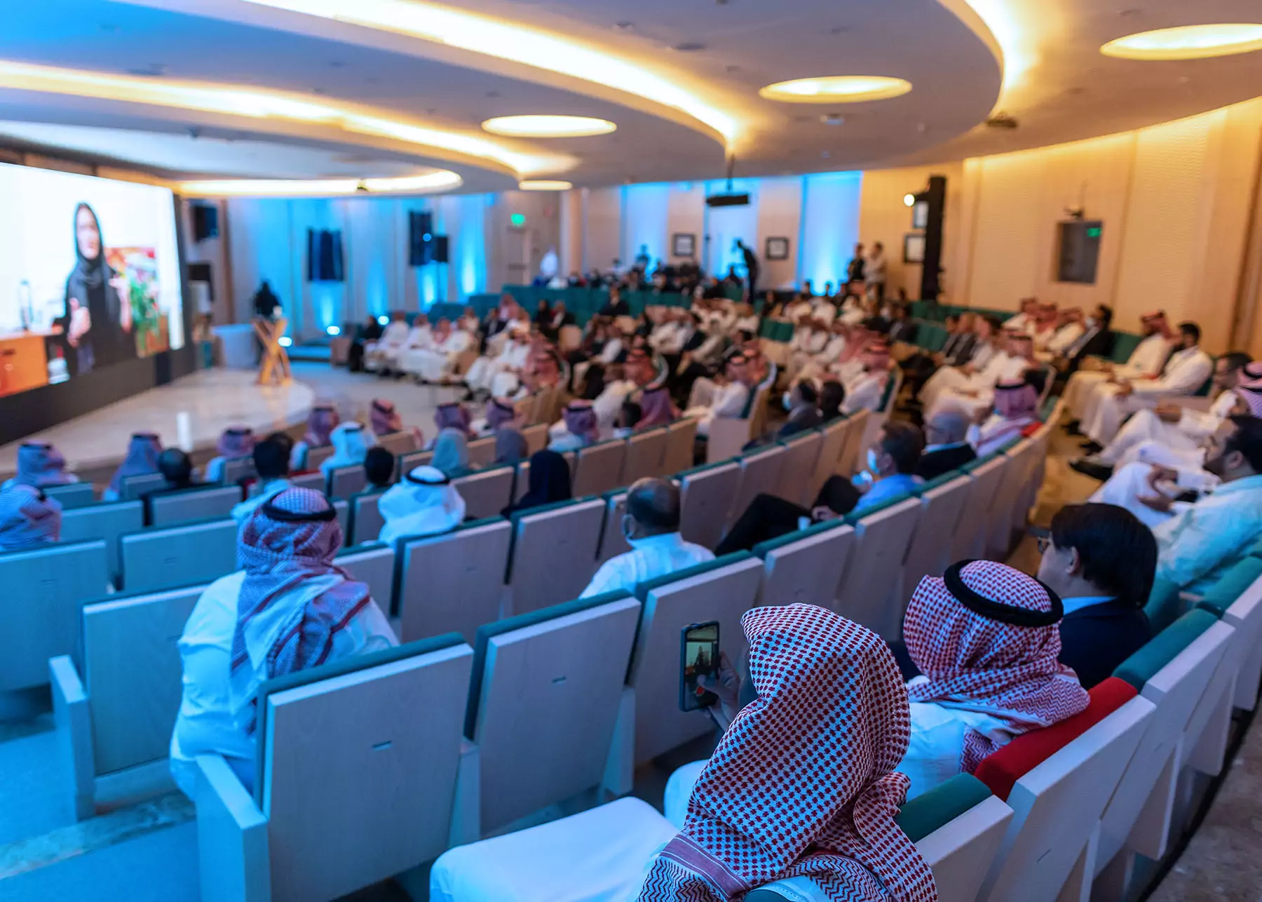 Audience listening to the speaker on stage