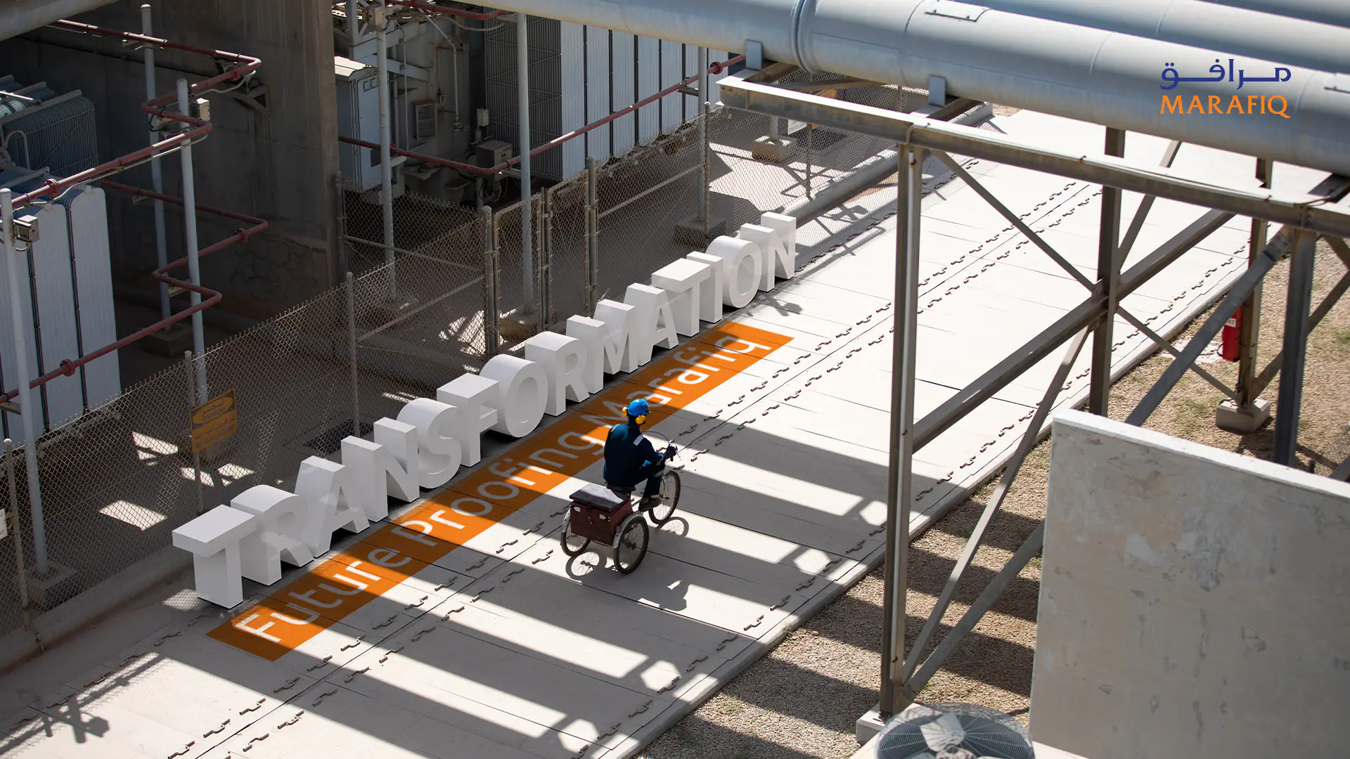 Factory employee riding a bicycle