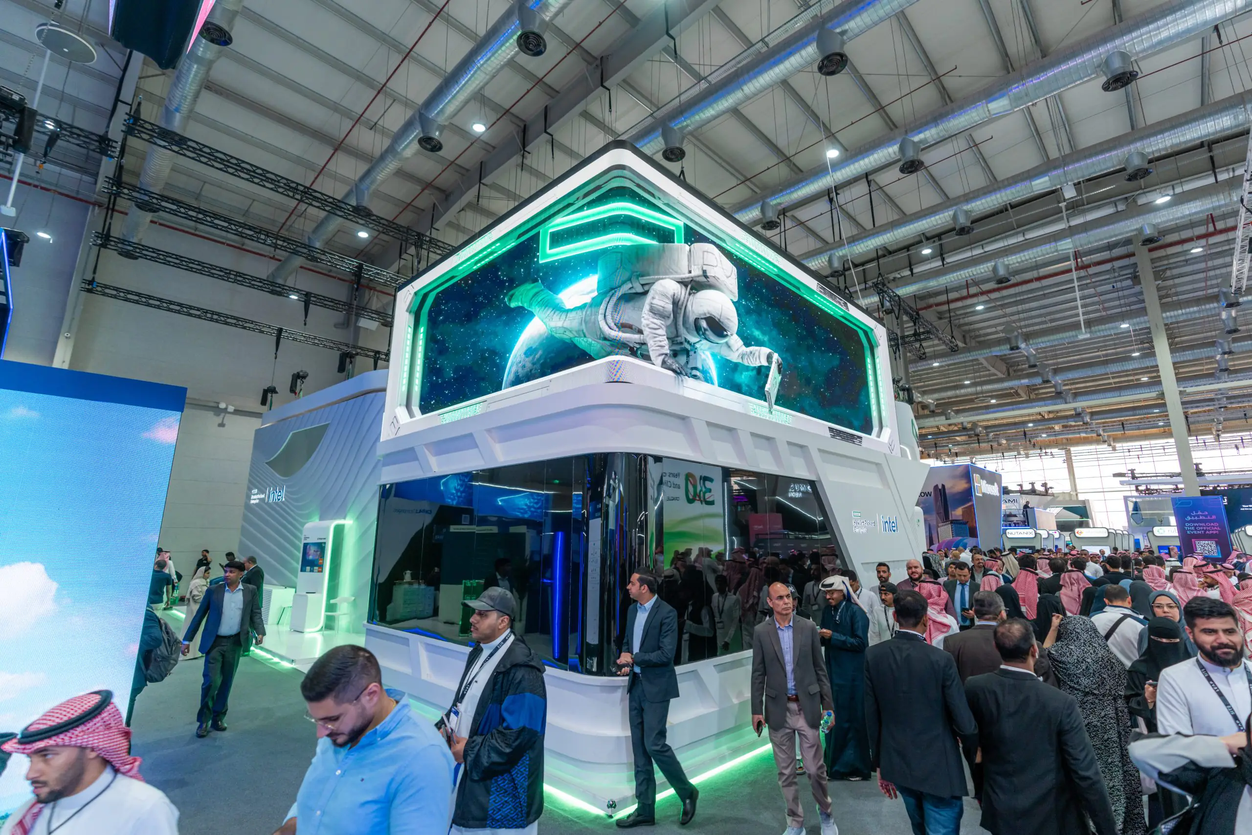 HPE booth at LEAP event featuring a large astronaut display, futuristic design, and Intel branding, with attendees gathered around