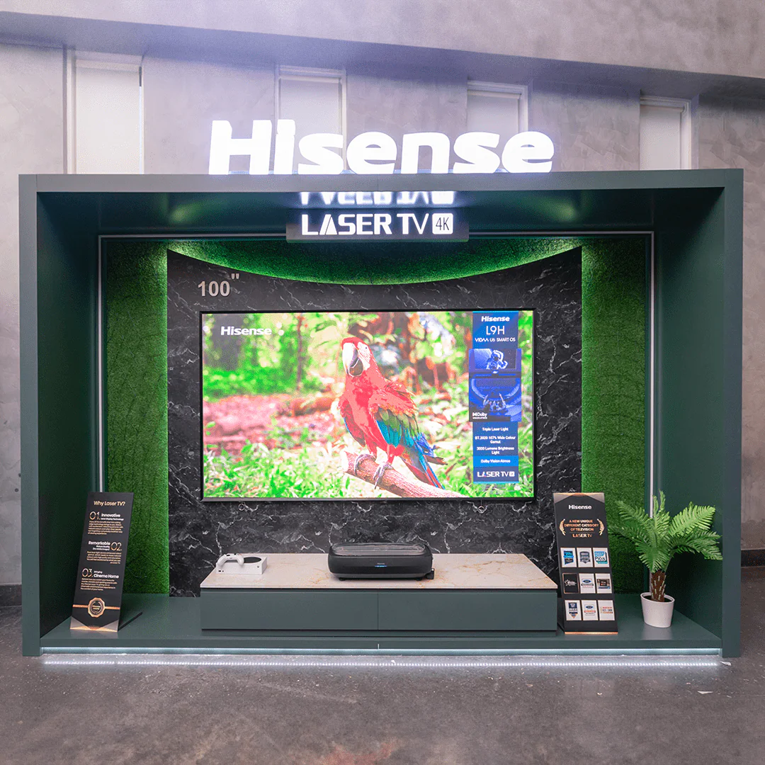 Hisense Laser TV 4K display showcasing a 100-inch screen with a parrot on display at the Real Madrid event