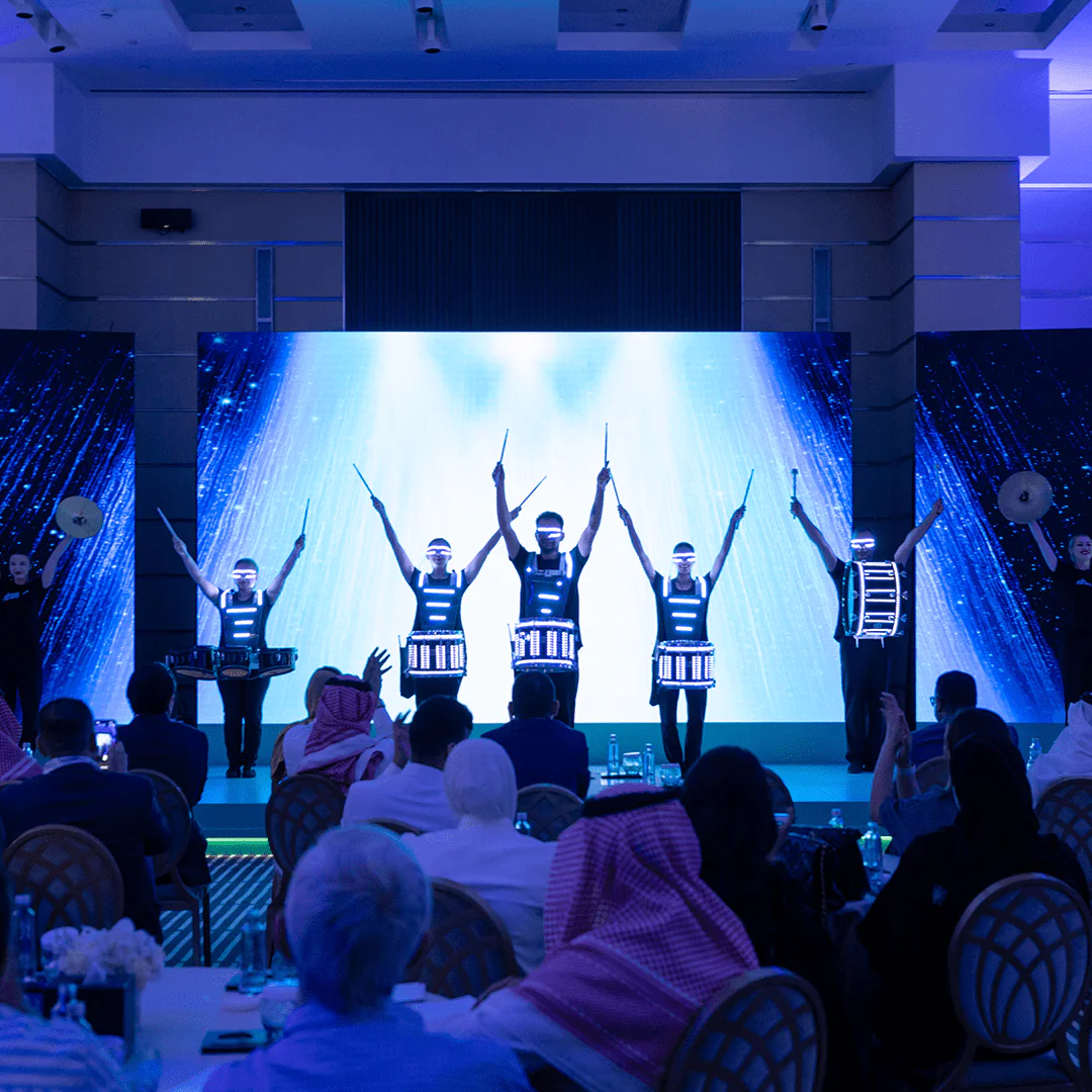 Performance of LED drummers on stage at the Hisense Real Madrid event, captivating the audience