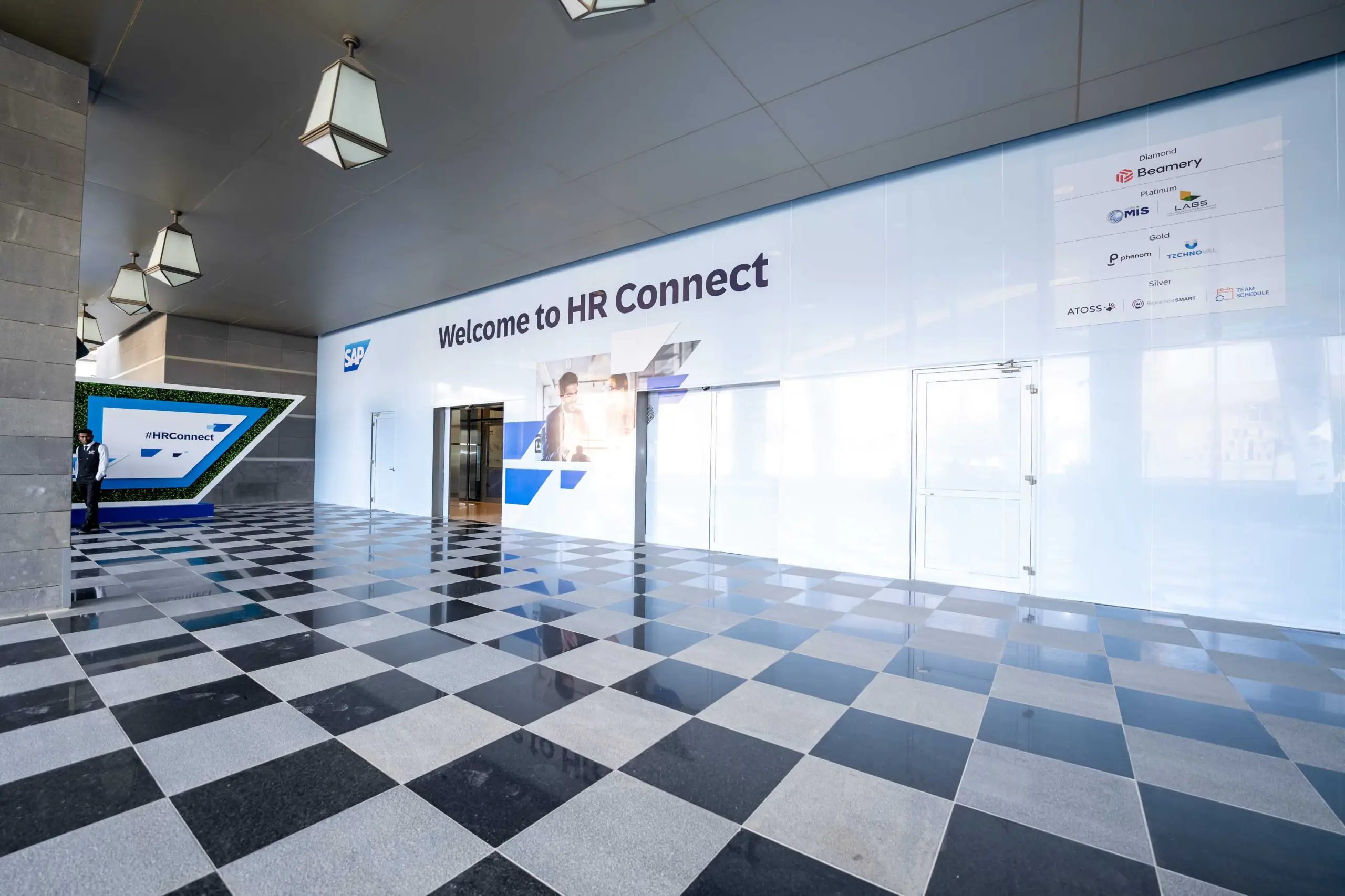 Entrance for SAP HR Connect in Riyadh with a welcome banner.