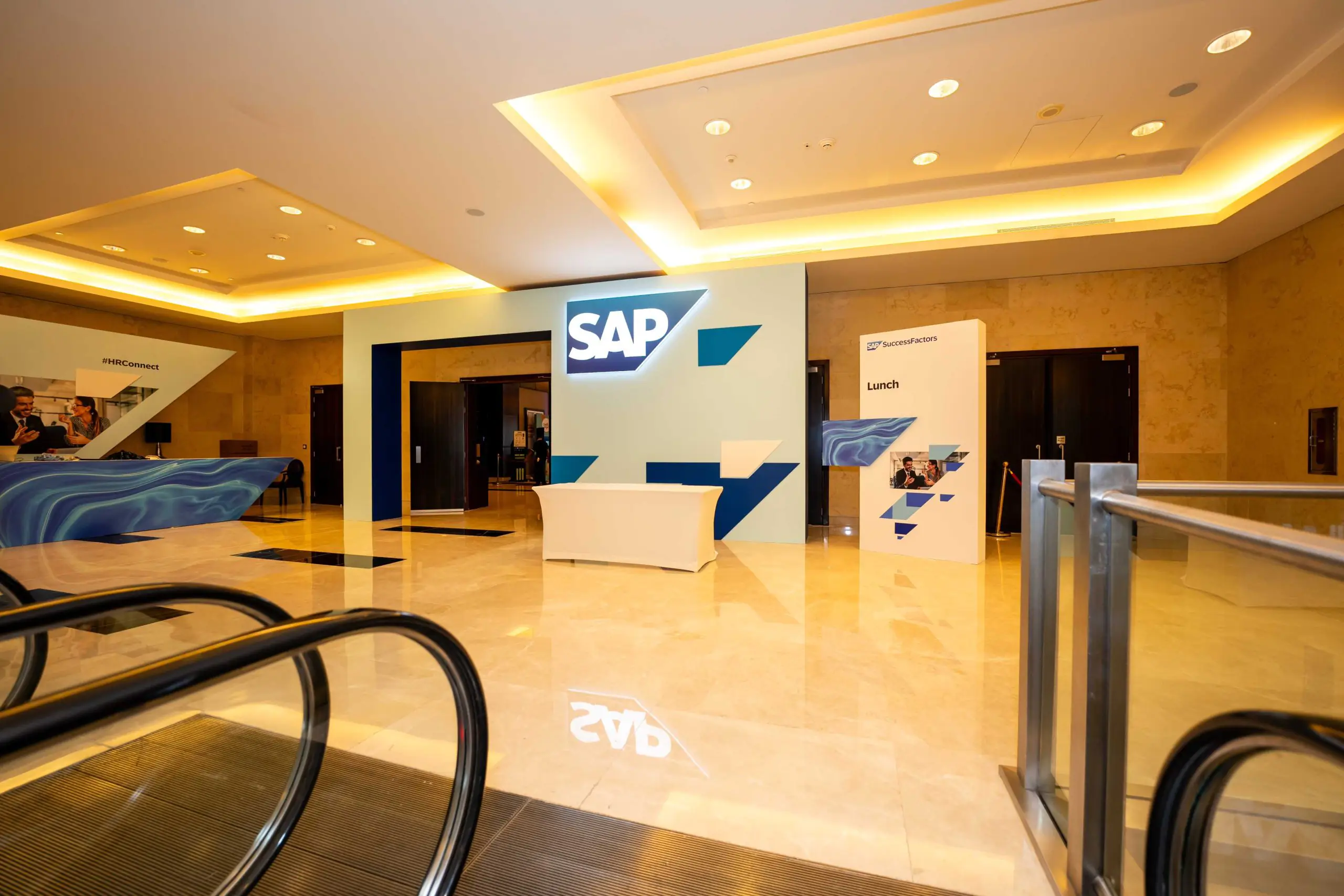 Event space featuring SAP logo and lunch signs.