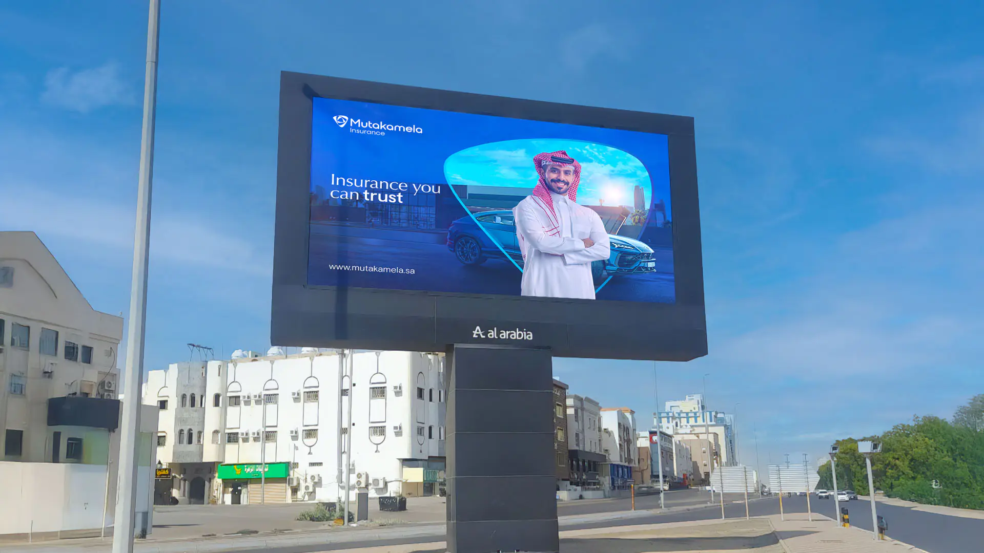 Dynamic outdoor campaign in Dammam highlighting Mutakamela's bold transformation and message of trust.