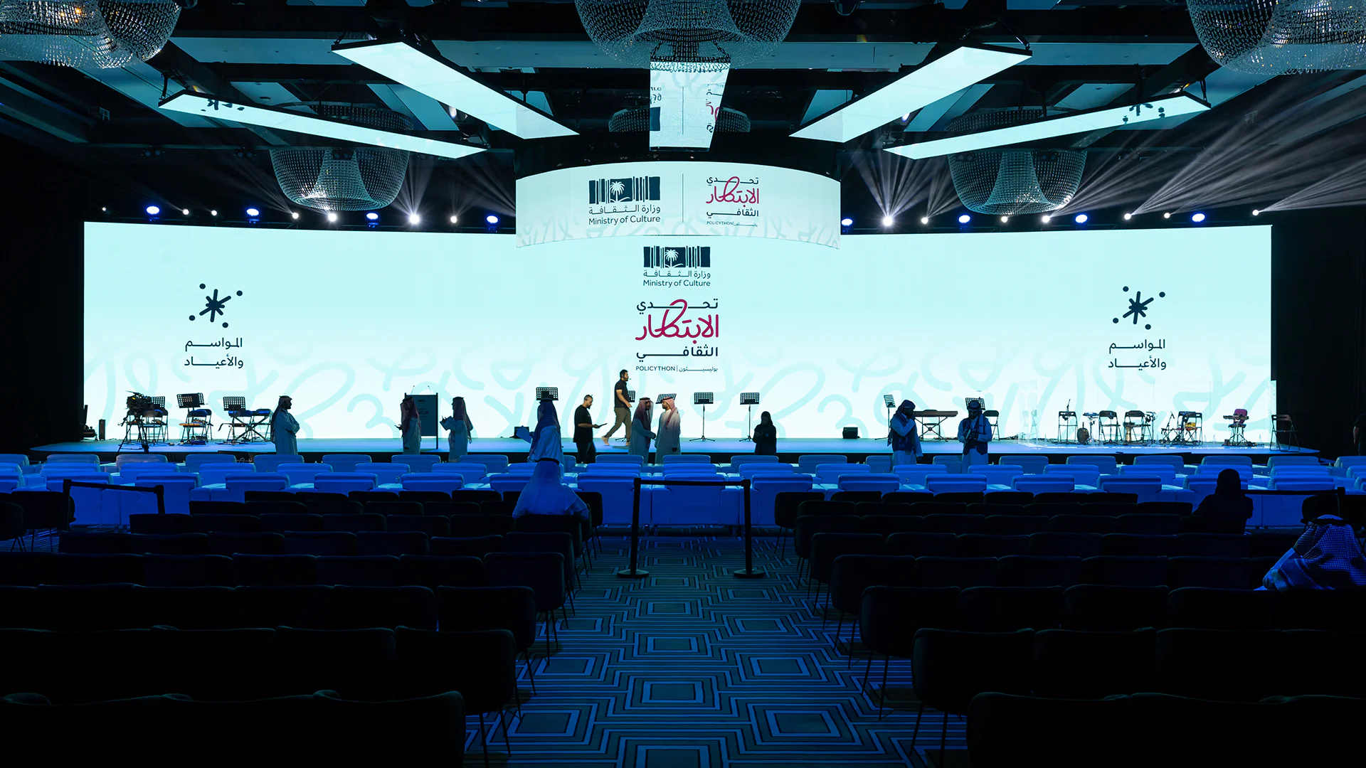 Panoramic view of the main stage with 'Seasons and Occasions' displayed on the Policython screen.