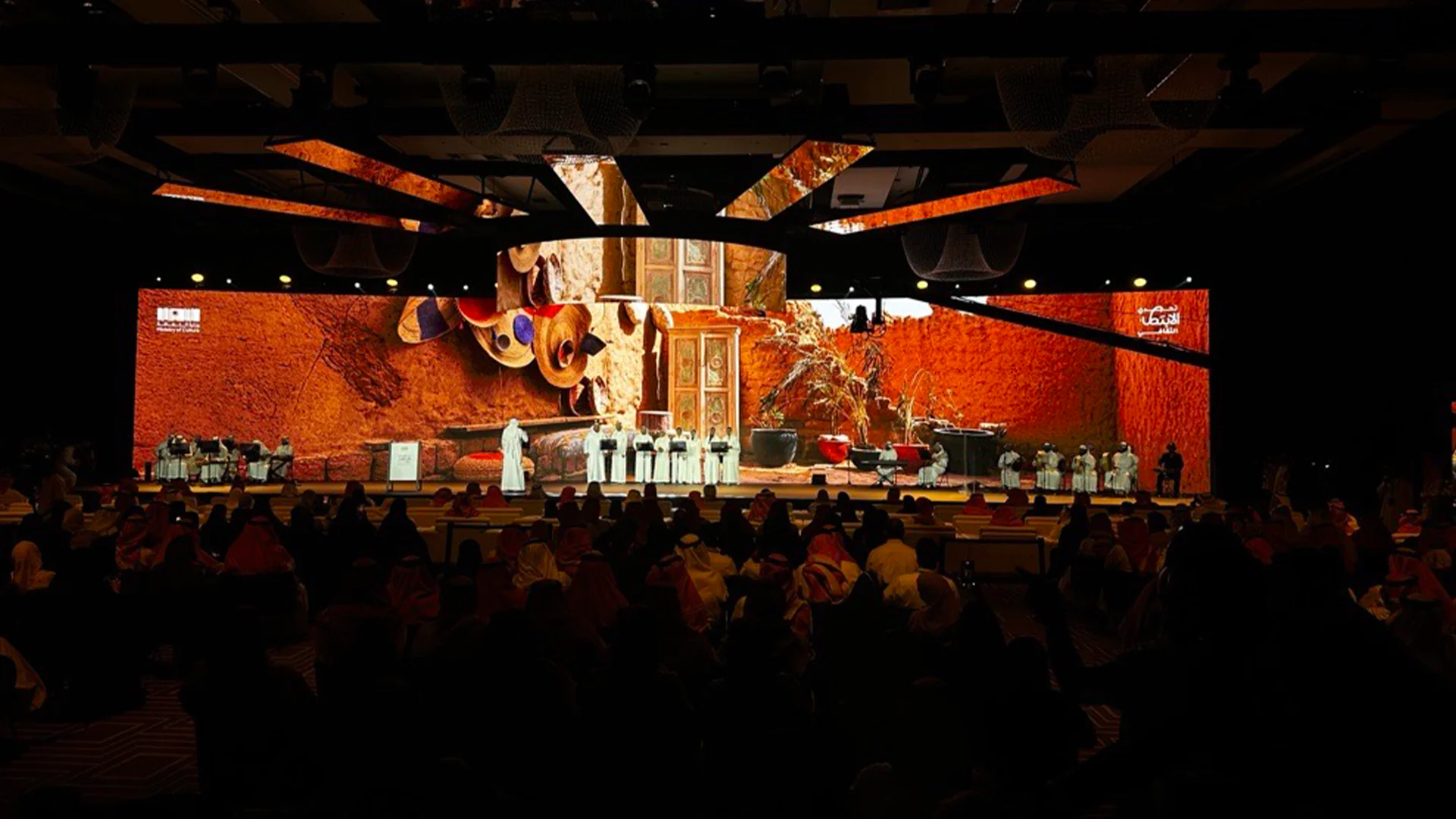 Final Cultural Policython event with traditional Saudi stage design and live performances in front of VIP audience.