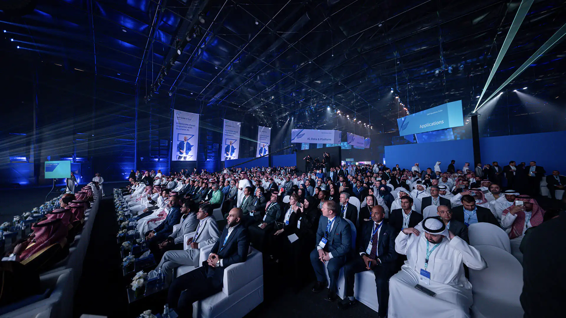 Packed SAP NOW AI Tour audience seated in the main hall during keynote sessions.