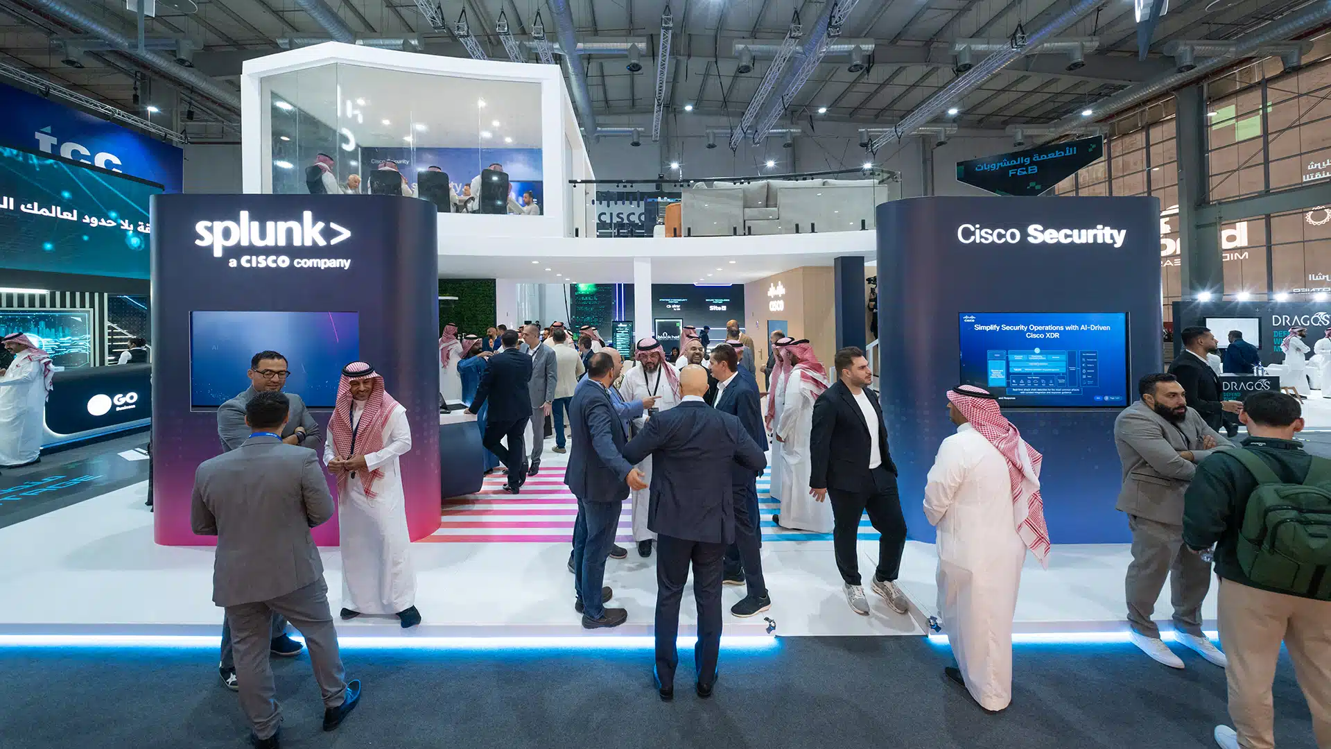 Front view of Cisco Security and Splunk partner pods with visitor engagement at Black Hat 2025.