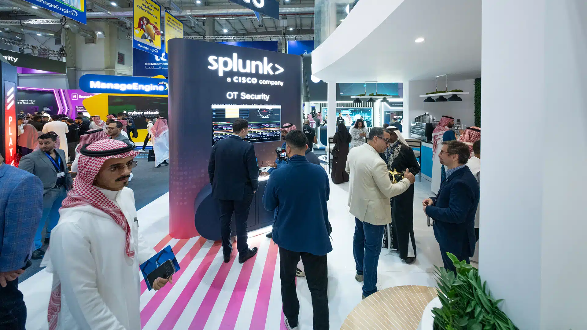 Splunk OT Security partner pod inside Cisco booth with live demo area at Black Hat 2025.