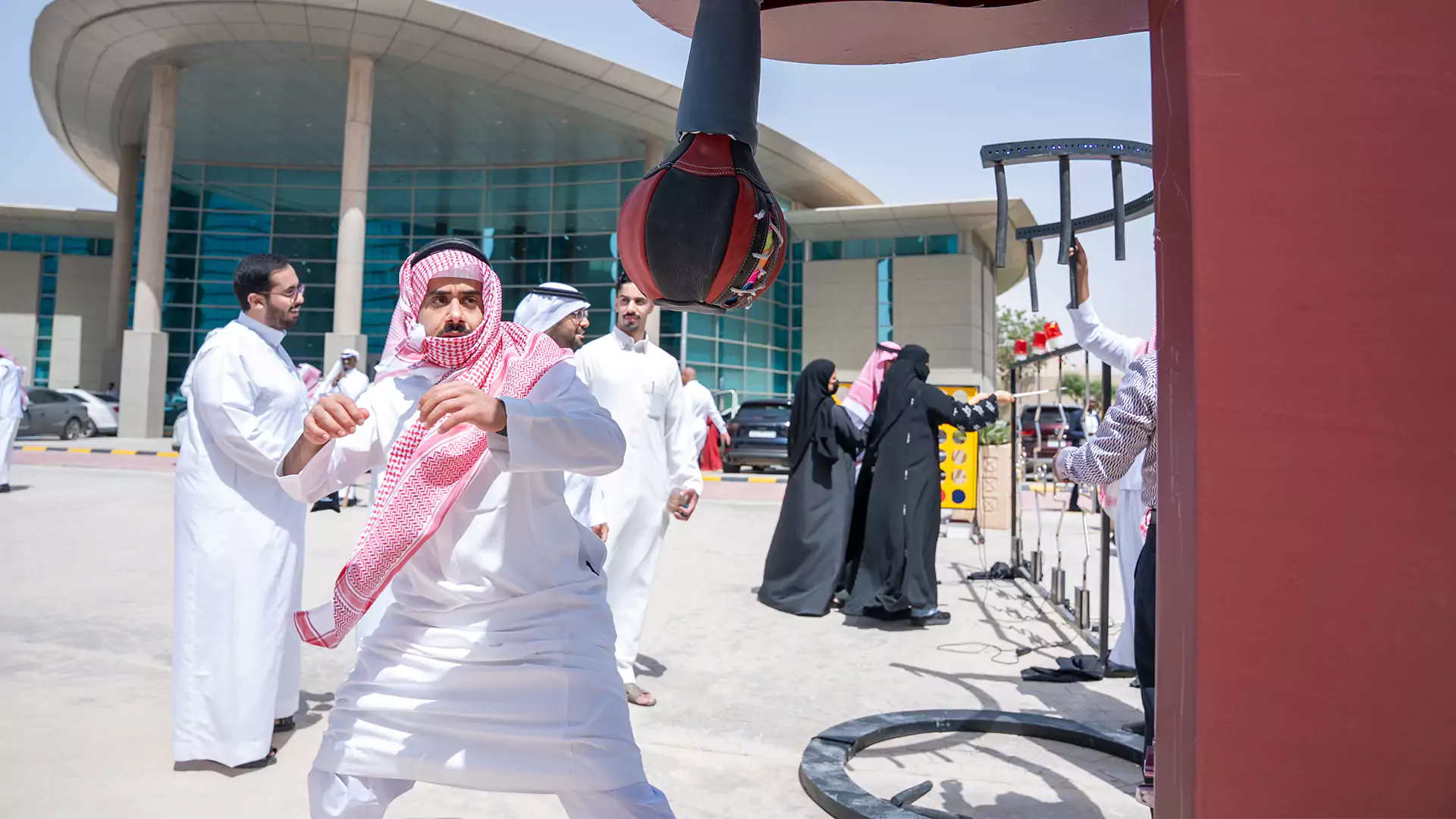 Visitor playing punching game at Granada Business Eid event