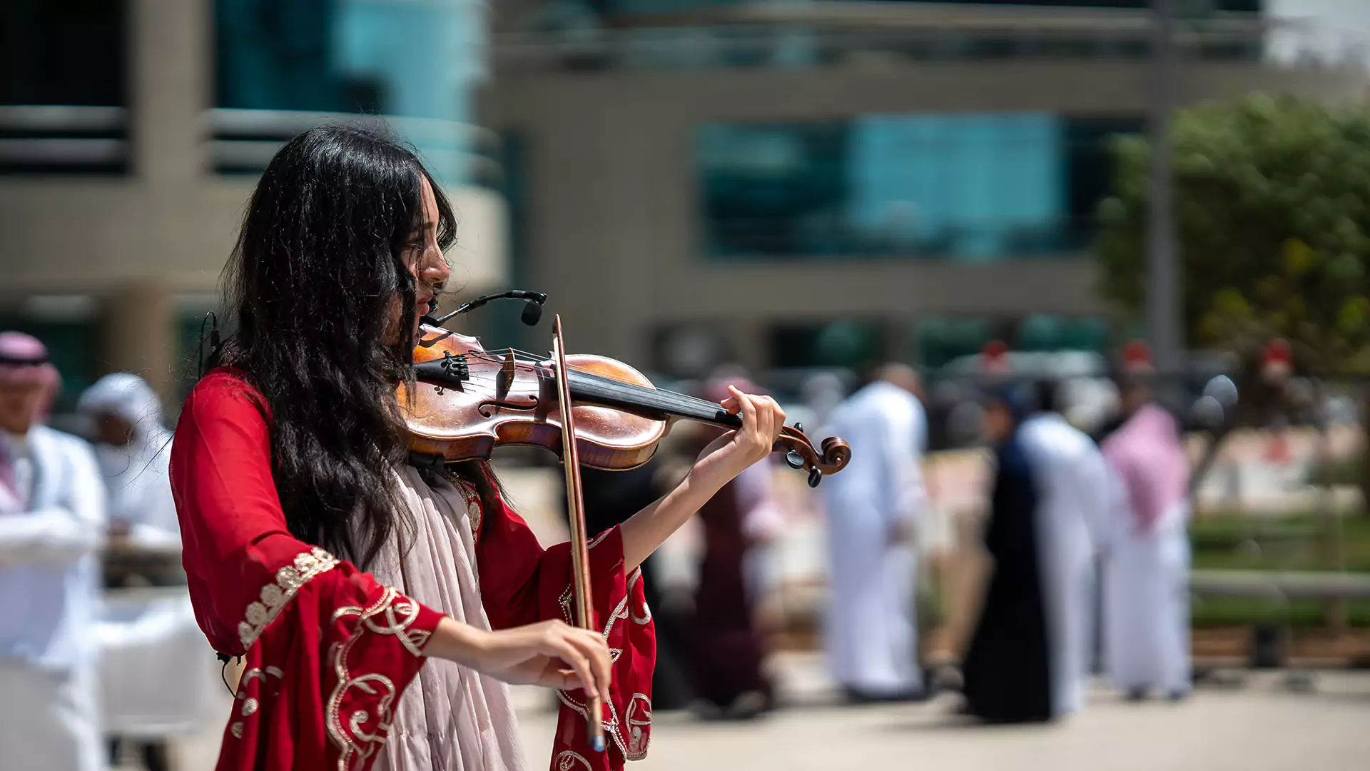 Violinist performing live music during Eid activation at Granada Business