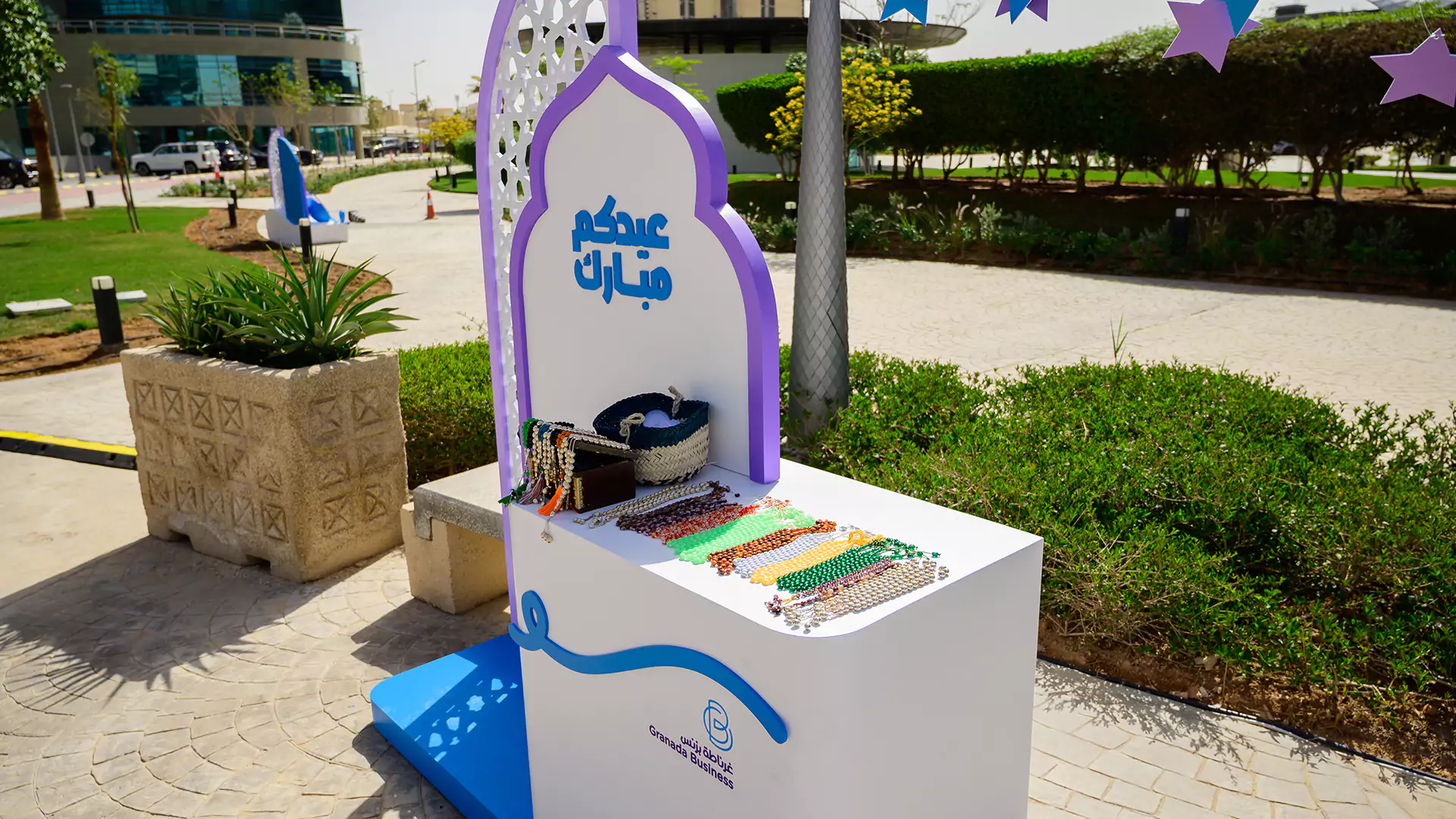 Eid-themed display with bracelets and traditional items at outdoor activation