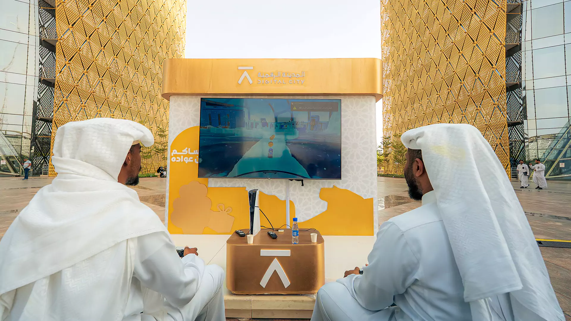 Men playing interactive video game at Digital City activation booth