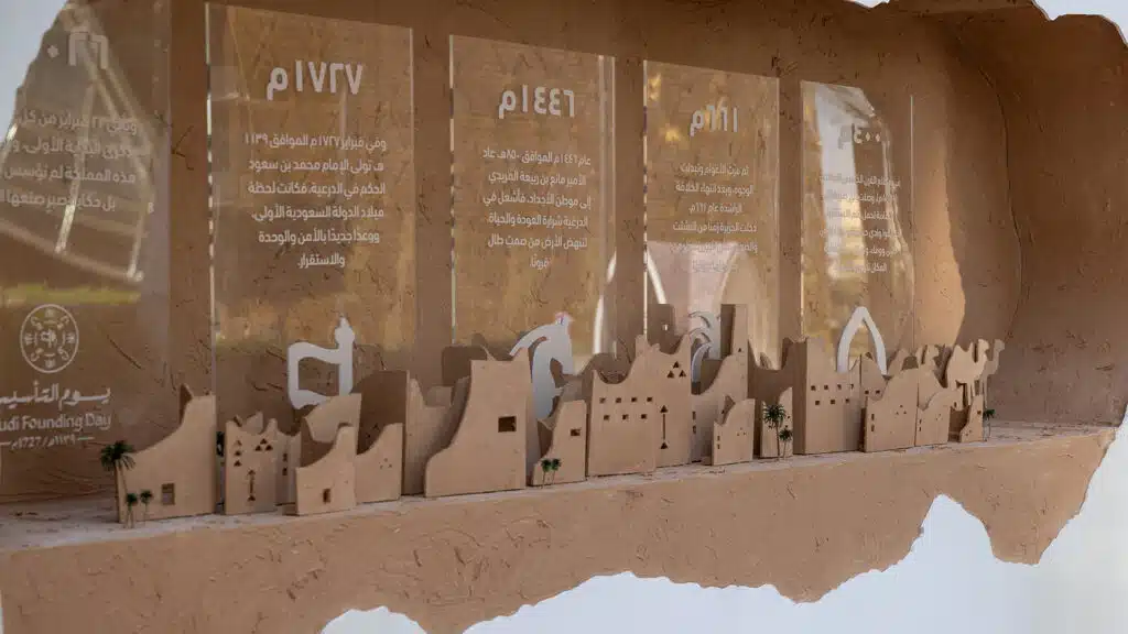 Detailed view of Saudi heritage model within Founding Day installation
