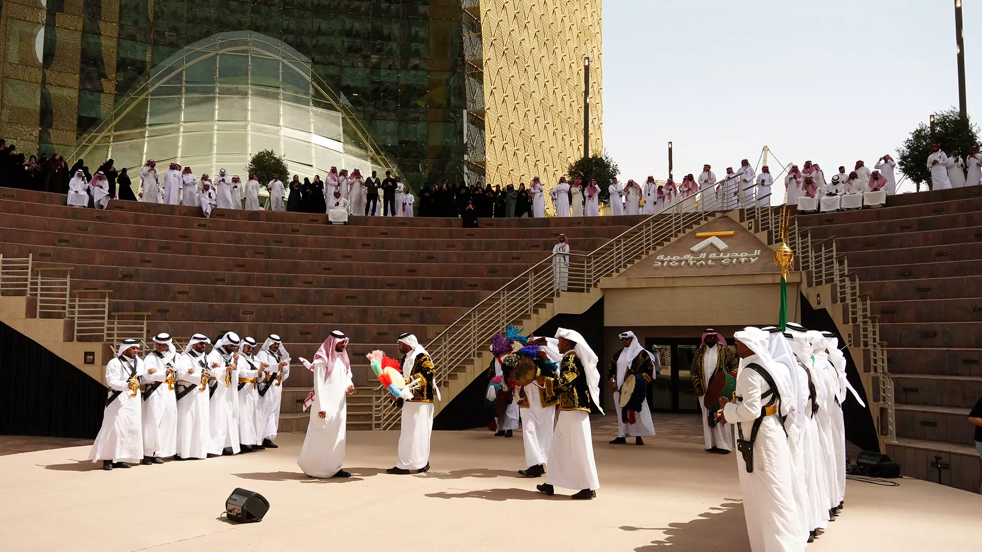 Traditional Saudi Ardah performance in amphitheater with audience at Digital City