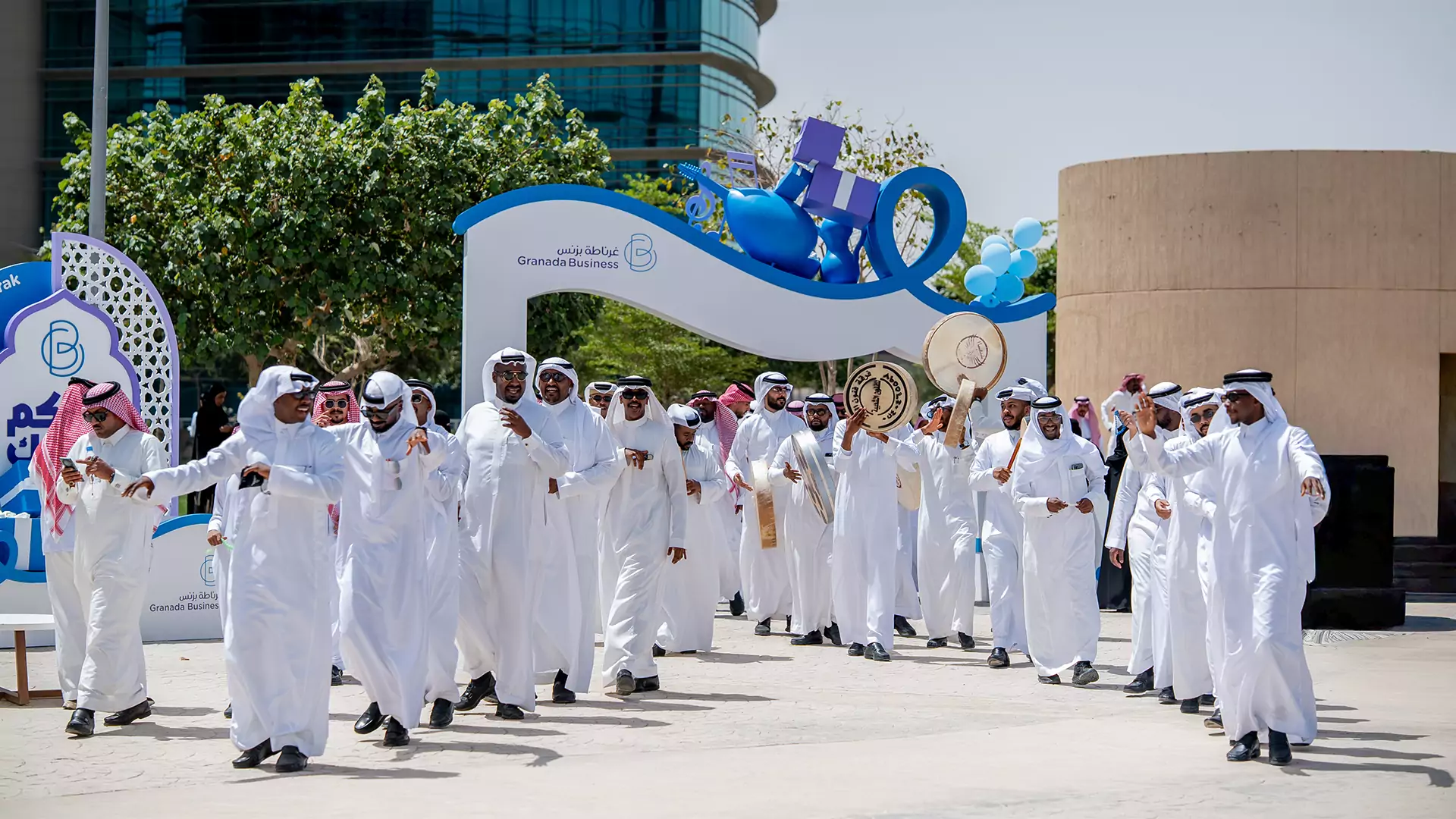Group performing traditional Ardah dance at Granada Business Eid event