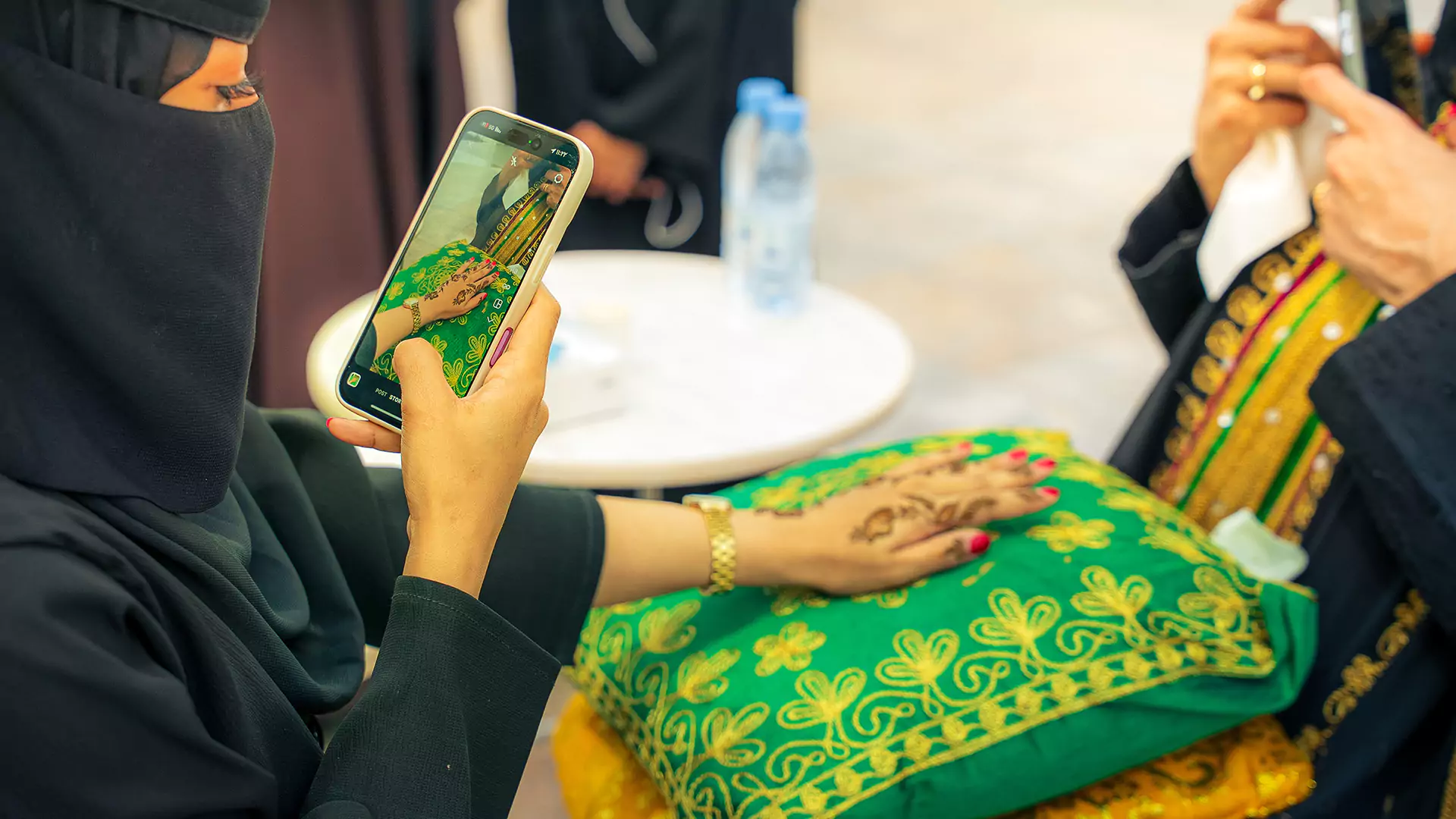 Close-up of henna art being applied during Eid cultural activation