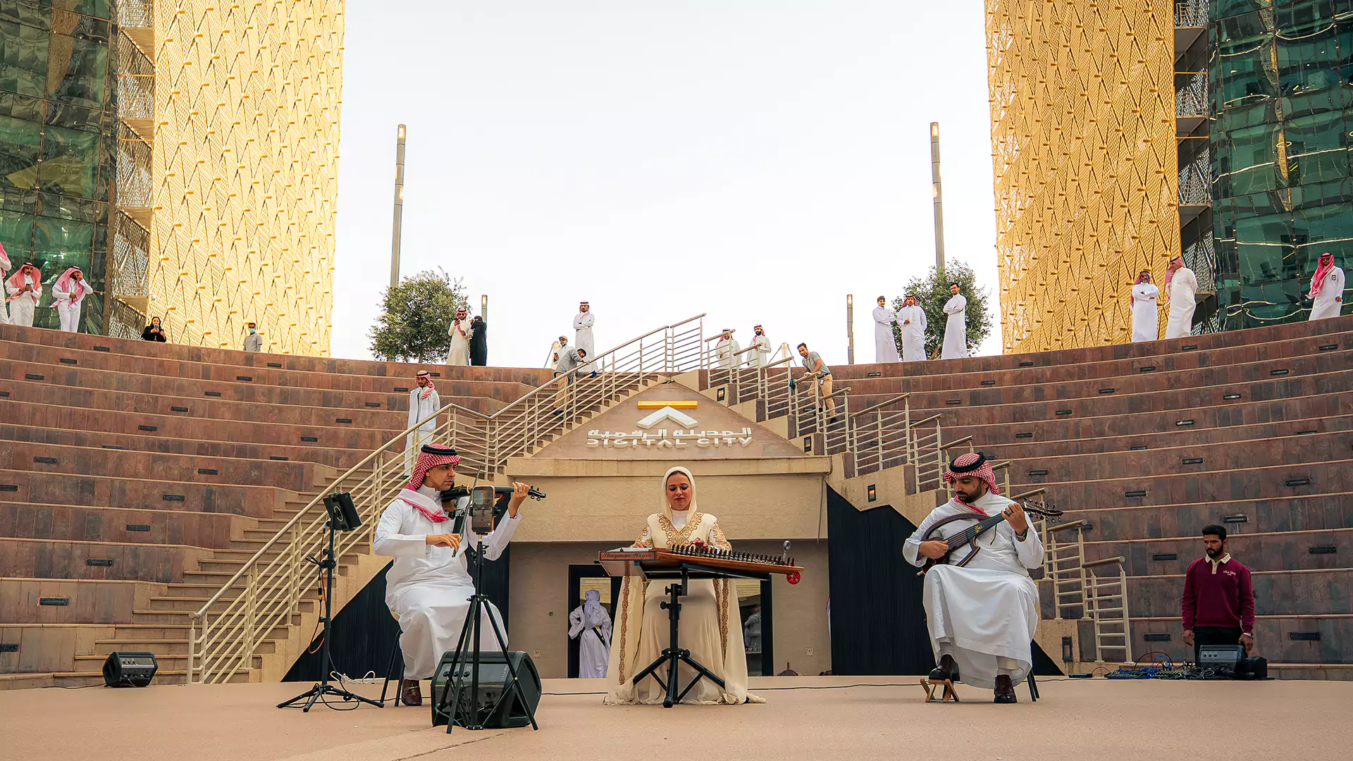 Live music performance with traditional instruments at Digital City stage